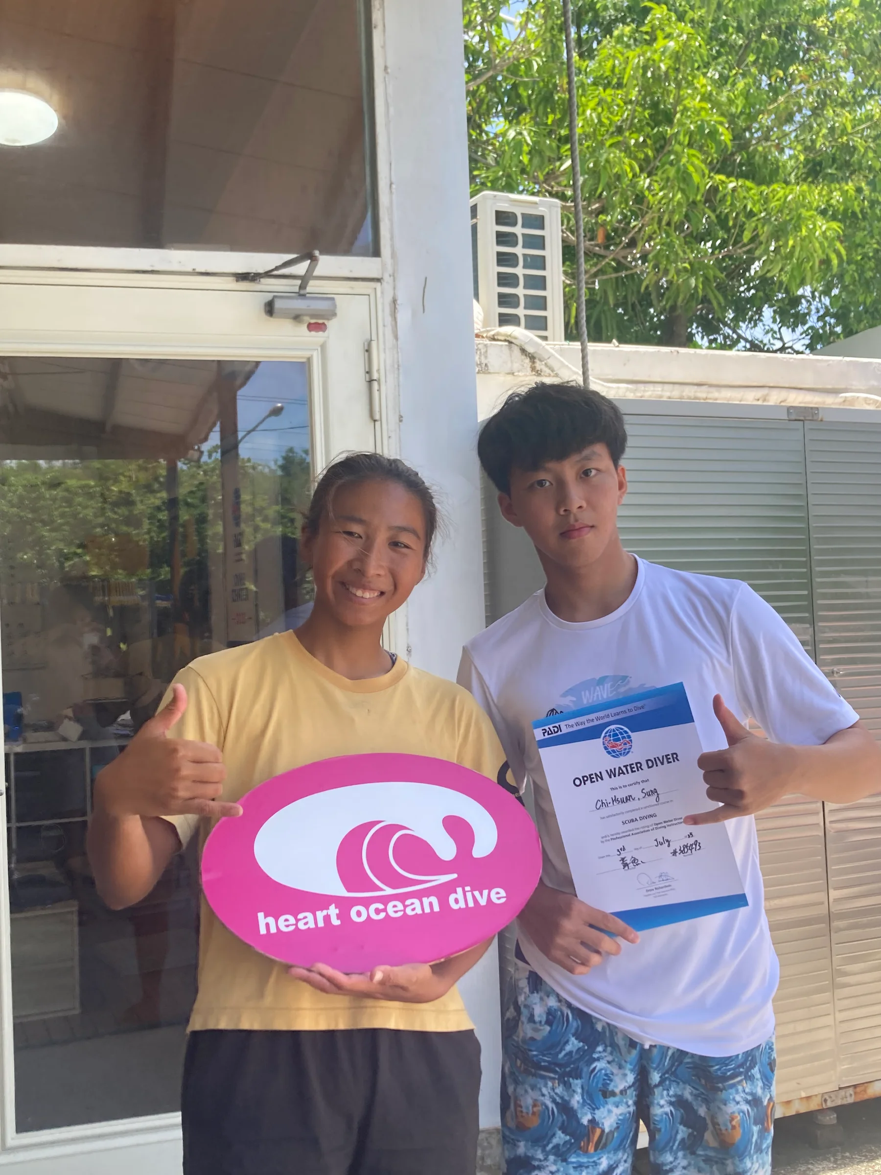 Benjamin receiving his PADI Open Water Diver certificate