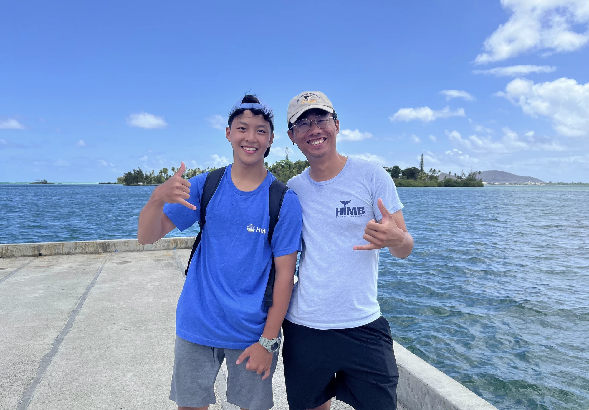 Benjamin speaking with a marine expert at HIMB